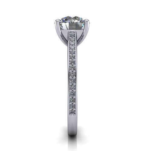 Nicole round solitaire engagement ring in Platinum, side profile showing the vintage scrollwork engraving on the band