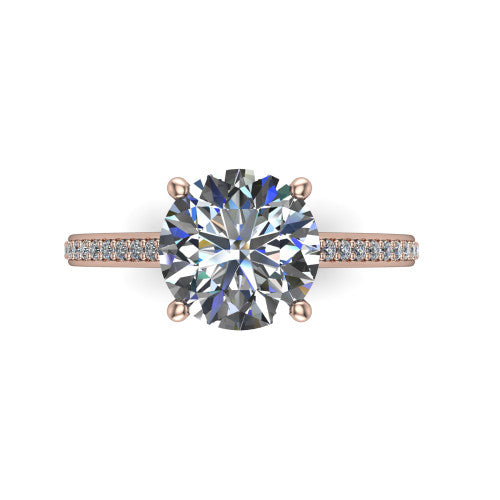 Nicole round solitaire engagement ring in 14K Rose Gold, top-down view showing the four-prong round center diamond and pave band
