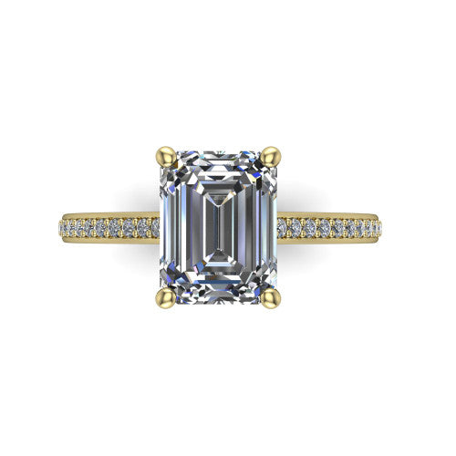 Nicole emerald solitaire engagement ring in 14K Yellow Gold, top-down view showing the four-prong emerald center diamond and pave band