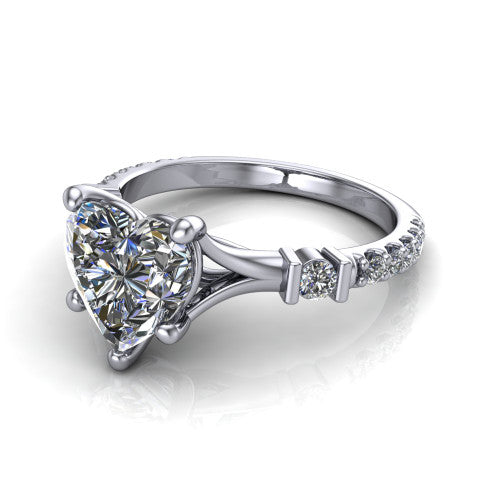 Arabella heart solitaire engagement ring in 18K White Gold, three-quarter perspective showing the heart center diamond above a pave band with bezel-set shoulder accents