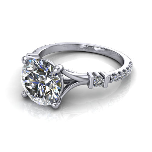 Arabella round solitaire engagement ring in 14K White Gold, three-quarter perspective showing the round center diamond above a pave band with bezel-set shoulder accents