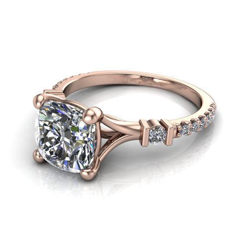 Arabella cushion solitaire engagement ring in 14K Rose Gold, three-quarter perspective showing the cushion center diamond above a pave band with bezel-set shoulder accents