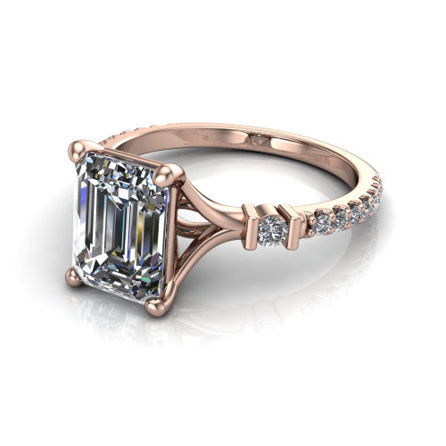 Arabella emerald solitaire engagement ring in 18K Rose Gold, three-quarter perspective showing the emerald center diamond above a pave band with bezel-set shoulder accents