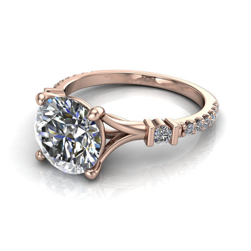 Arabella round solitaire engagement ring in 14K Rose Gold, three-quarter perspective showing the round center diamond above a pave band with bezel-set shoulder accents