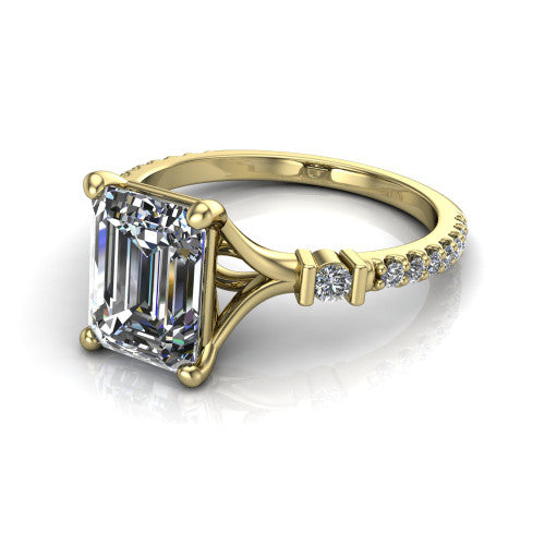 Arabella emerald solitaire engagement ring in 14K Yellow Gold, three-quarter perspective showing the emerald center diamond above a pave band with bezel-set shoulder accents