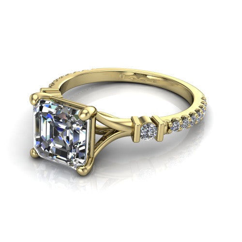 Arabella square emerald solitaire engagement ring in 18K Yellow Gold, three-quarter perspective showing the square emerald center diamond above a pave band with bezel-set shoulder accents