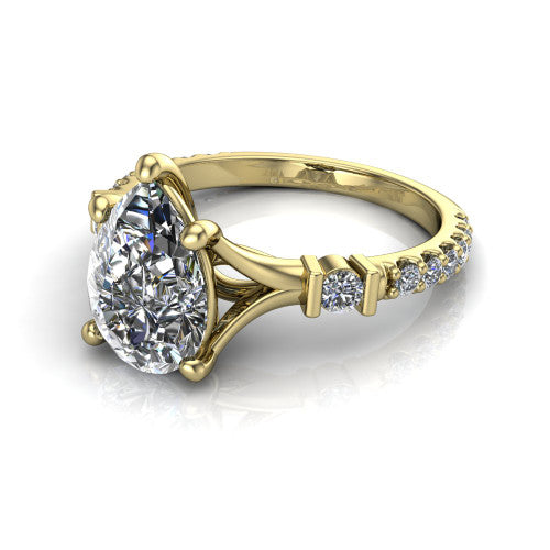 Arabella pear solitaire engagement ring in 14K Yellow Gold, three-quarter perspective showing the pear center diamond above a pave band with bezel-set shoulder accents