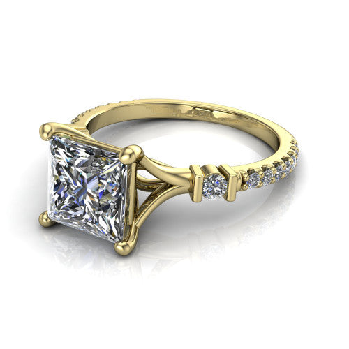 Arabella princess solitaire engagement ring in 18K Yellow Gold, three-quarter perspective showing the princess center diamond above a pave band with bezel-set shoulder accents