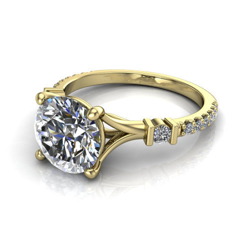 Arabella round solitaire engagement ring in 14K Yellow Gold, three-quarter perspective showing the round center diamond above a pave band with bezel-set shoulder accents