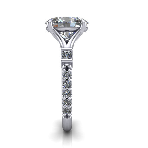 Arabella oval solitaire engagement ring in Platinum, side profile showing the bezel-set square accents and pave band