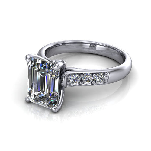 Nena emerald solitaire engagement ring in 18K White Gold, three-quarter perspective showing the emerald center diamond above channel-set shoulders
