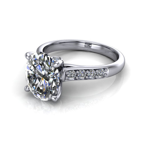 Nena oval solitaire engagement ring in 18K White Gold, three-quarter perspective showing the oval center diamond above channel-set shoulders