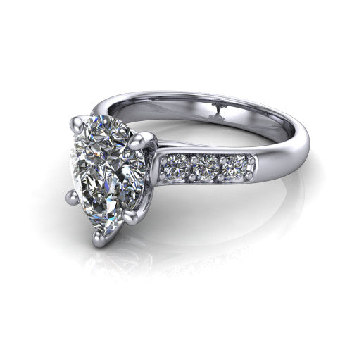 Nena pear solitaire engagement ring in Platinum, three-quarter perspective showing the pear center diamond above channel-set shoulders