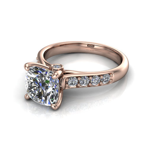 Nena cushion solitaire engagement ring in 18K Rose Gold, three-quarter perspective showing the cushion center diamond above channel-set shoulders