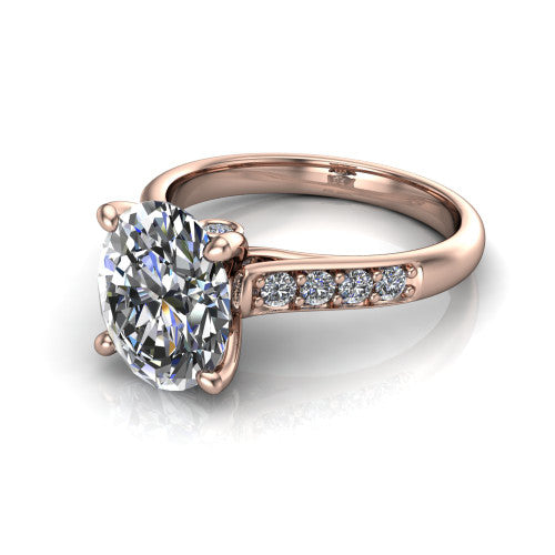 Nena oval solitaire engagement ring in 14K Rose Gold, three-quarter perspective showing the oval center diamond above channel-set shoulders