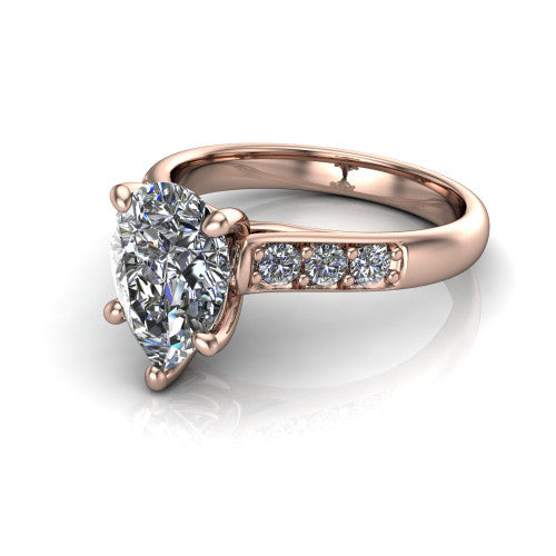 Nena pear solitaire engagement ring in 14K Rose Gold, three-quarter perspective showing the pear center diamond above channel-set shoulders