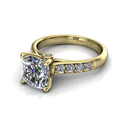 Nena cushion solitaire engagement ring in 18K Yellow Gold, three-quarter perspective showing the cushion center diamond above channel-set shoulders