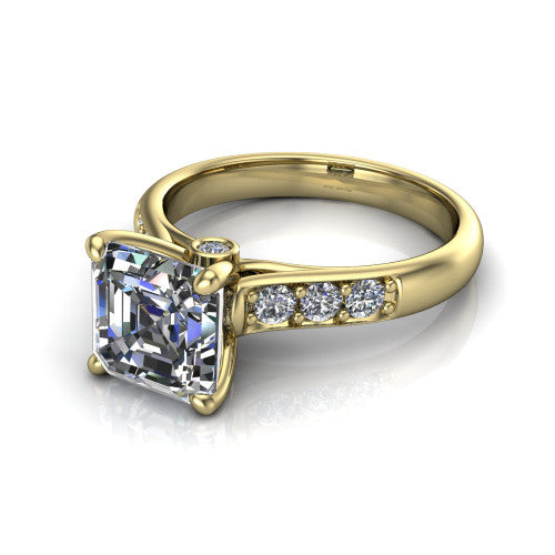 Nena square emerald solitaire engagement ring in 18K Yellow Gold, three-quarter perspective showing the square emerald center diamond above channel-set shoulders
