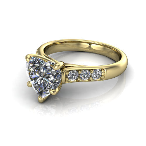 Nena heart solitaire engagement ring in 18K Yellow Gold, three-quarter perspective showing the heart center diamond above channel-set shoulders