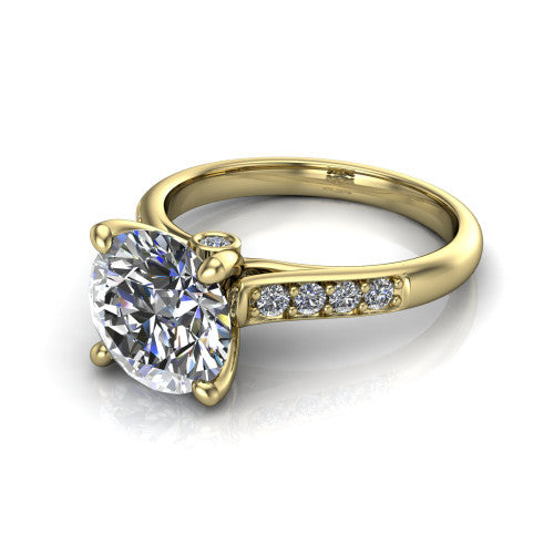 Nena round solitaire engagement ring in 14K Yellow Gold, three-quarter perspective showing the round center diamond above channel-set shoulders