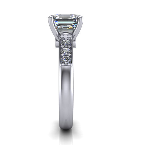 Nena square emerald solitaire engagement ring in Platinum, side profile showing the channel-set shoulder diamonds