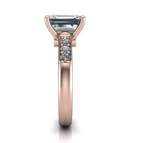 Nena emerald solitaire engagement ring in 14K Rose Gold, side profile showing the channel-set shoulder diamonds