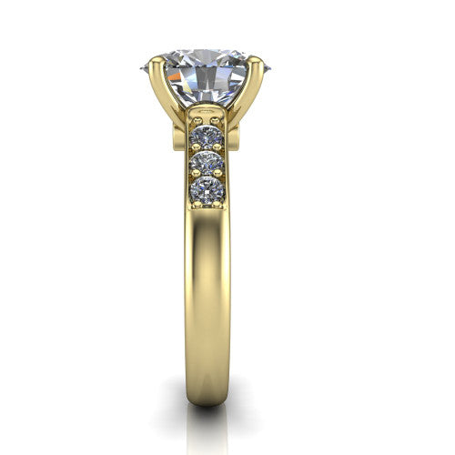 Nena oval solitaire engagement ring in 18K Yellow Gold, side profile showing the channel-set shoulder diamonds