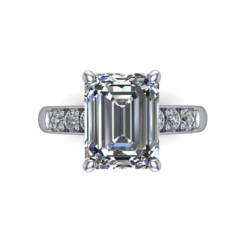 Nena emerald solitaire engagement ring in Platinum, top-down view showing the four-prong emerald center diamond and channel-set shoulders
