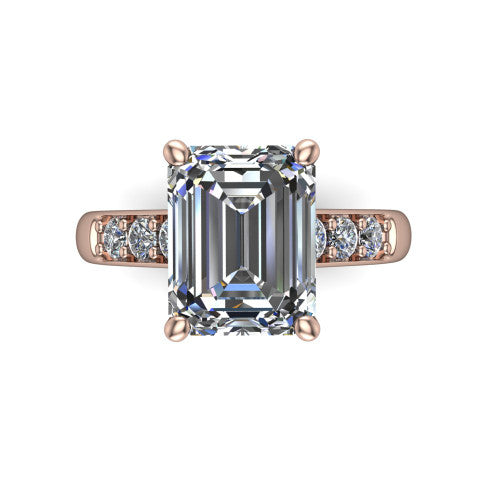 Nena emerald solitaire engagement ring in 14K Rose Gold, top-down view showing the four-prong emerald center diamond and channel-set shoulders