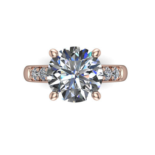 Nena round solitaire engagement ring in 14K Rose Gold, top-down view showing the four-prong round center diamond and channel-set shoulders