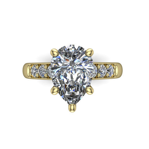 Nena pear solitaire engagement ring in 18K Yellow Gold, top-down view showing the four-prong pear center diamond and channel-set shoulders