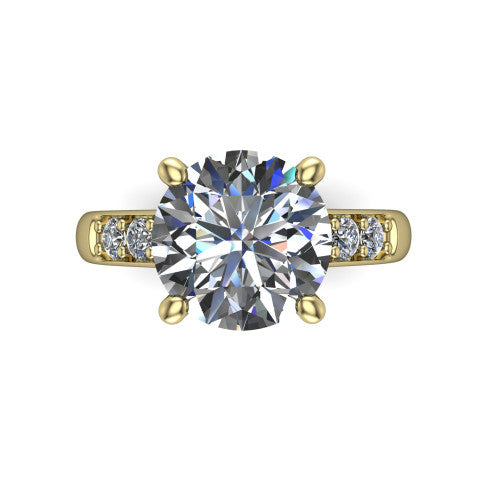 Nena round solitaire engagement ring in 18K Yellow Gold, top-down view showing the four-prong round center diamond and channel-set shoulders