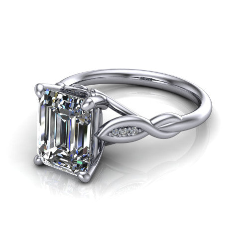 Lennon emerald solitaire engagement ring in Platinum, three-quarter perspective showing the emerald center diamond above a twisted willow band