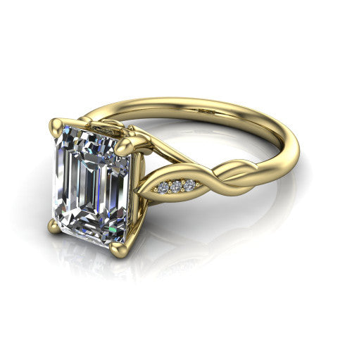 Lennon emerald solitaire engagement ring in 18K Yellow Gold, three-quarter perspective showing the emerald center diamond above a twisted willow band