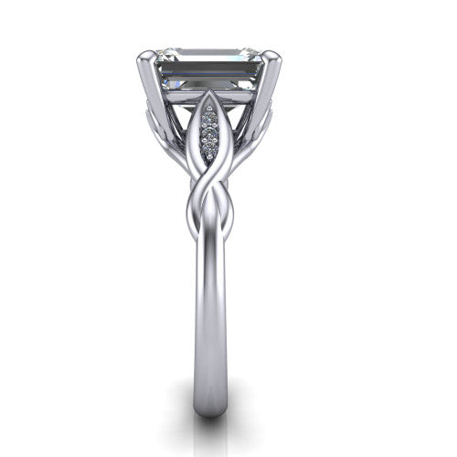 Lennon emerald solitaire engagement ring in 18K White Gold, side profile showing the twisted infinity band with accent diamonds