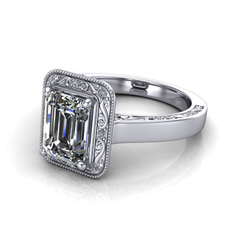 Elara emerald-cut vintage engagement ring in 18K White Gold, three-quarter perspective showing the emerald-cut center diamond, milgrain halo, and hand-engraved band