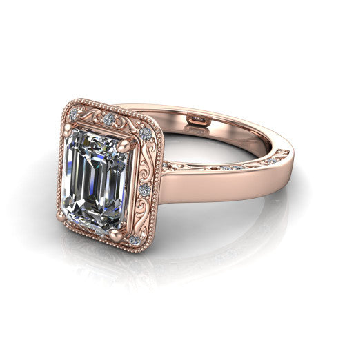 Elara emerald-cut vintage engagement ring in 18K Rose Gold, three-quarter perspective showing the emerald-cut center diamond, milgrain halo, and hand-engraved band