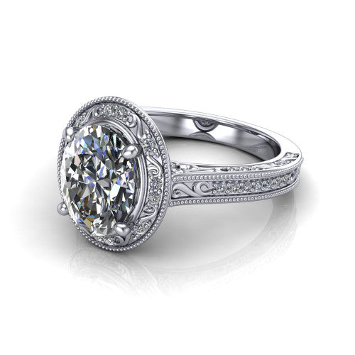 Juliana oval vintage halo engagement ring in 18K White Gold, three-quarter perspective showing the oval center diamond, milgrain halo, and hand-engraved band