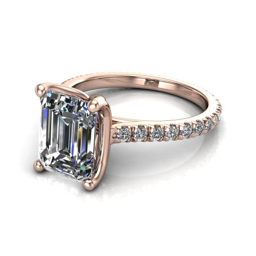 Honora emerald-cut solitaire engagement ring in 14K Rose Gold, three-quarter perspective showing the emerald-cut center diamond, double-claw prongs, and pavé band