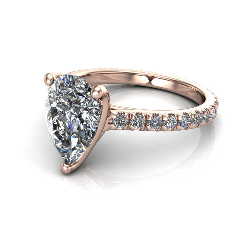 Honora pear-shaped solitaire engagement ring in 14K Rose Gold, three-quarter perspective showing the pear-shaped center diamond, double-claw prongs, and pavé band