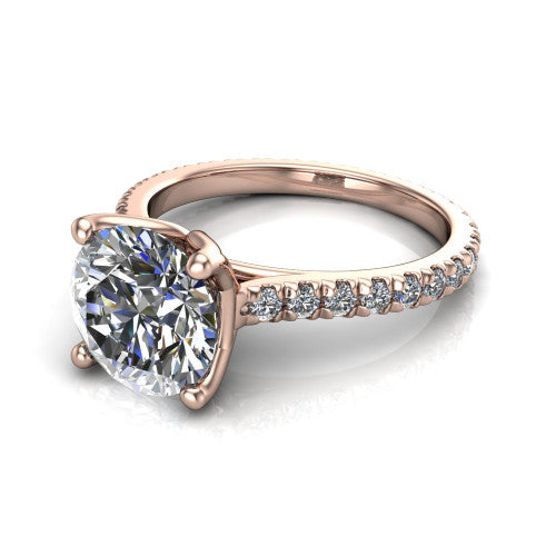 Honora round solitaire engagement ring in 14K Rose Gold, three-quarter perspective showing the round center diamond, double-claw prongs, and pavé band