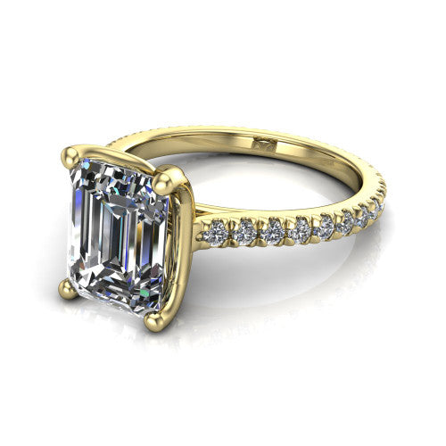 Honora emerald-cut solitaire engagement ring in 18K Yellow Gold, three-quarter perspective showing the emerald-cut center diamond, double-claw prongs, and pavé band