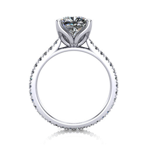 Honora cushion-cut solitaire engagement ring in Platinum, through-finger front profile showing the hidden halo beneath the head