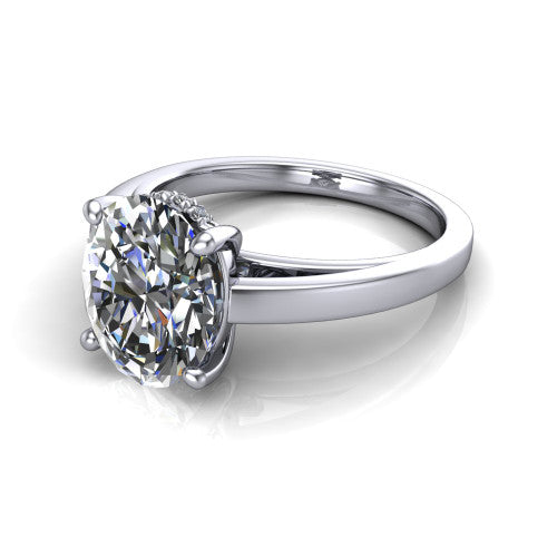 Itzel oval classic engagement ring in 18K White Gold, three-quarter perspective showing the oval center diamond, double-claw prongs, and polished band