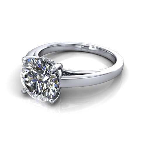 Itzel round classic engagement ring in 14K White Gold, three-quarter perspective showing the round center diamond, double-claw prongs, and polished band
