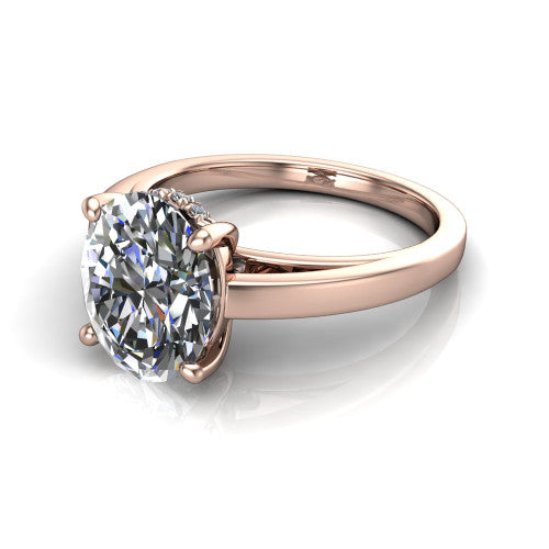 Itzel oval classic engagement ring in 18K Rose Gold, three-quarter perspective showing the oval center diamond, double-claw prongs, and polished band
