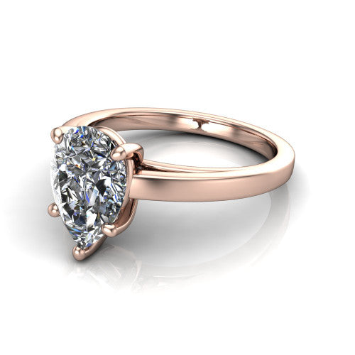 Itzel pear-shaped classic engagement ring in 18K Rose Gold, three-quarter perspective showing the pear-shaped center diamond, double-claw prongs, and polished band