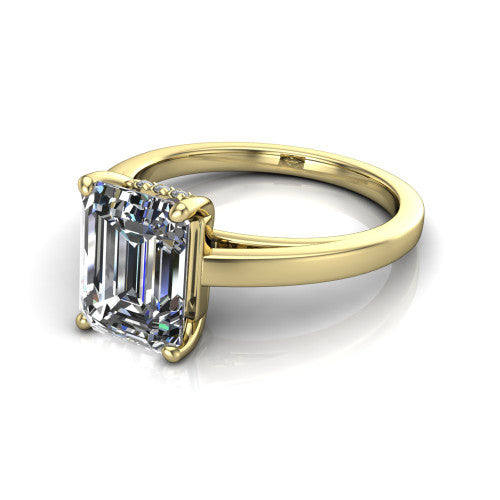 Itzel emerald-cut classic engagement ring in 14K Yellow Gold, three-quarter perspective showing the emerald-cut center diamond, double-claw prongs, and polished band