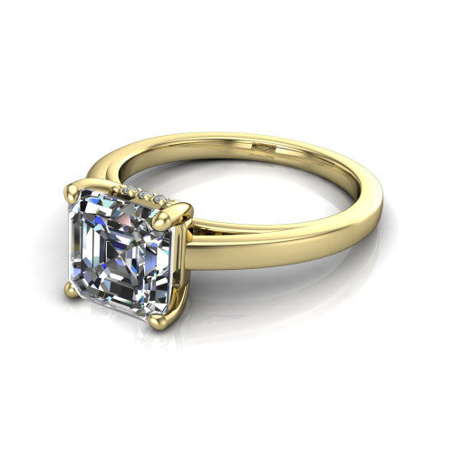 Itzel square emerald-cut classic engagement ring in 18K Yellow Gold, three-quarter perspective showing the square emerald-cut center diamond, double-claw prongs, and polished band