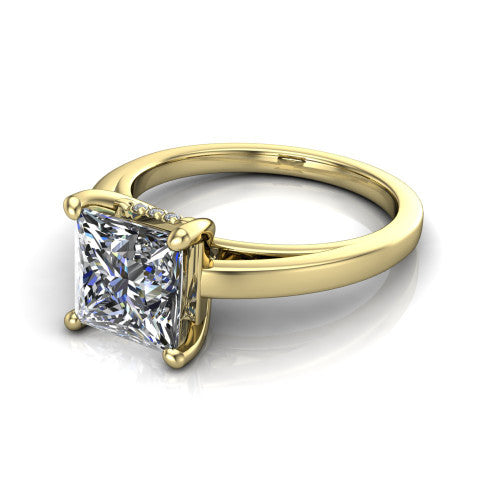 Itzel princess-cut classic engagement ring in 18K Yellow Gold, three-quarter perspective showing the princess-cut center diamond, double-claw prongs, and polished band